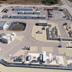 Vue aérienne d'une grande installation industrielle mettant en œuvre des technologies à hydrogène.