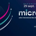 Bannière pour MICRONORA 2026, le salon international des microtechniques et de la précision qui se tiendra à Besançon, en France, du 29 septembre au 2 octobre, avec des arcs graphiques et les détails de l'événement sur fond sombre.